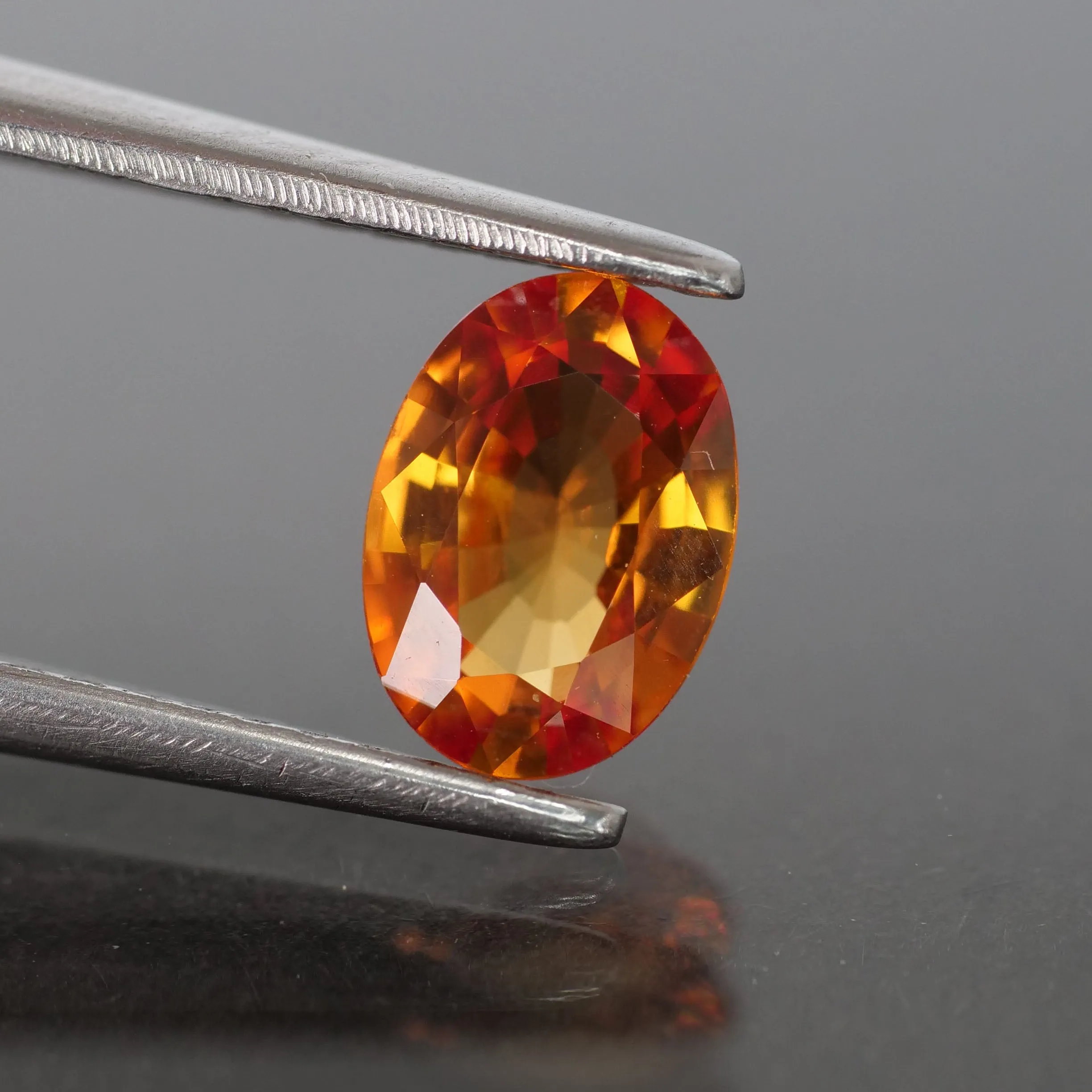 Sapphire | natural, orange, oval cut 7x5 mm, 0.87ct, Songea, Tanzania