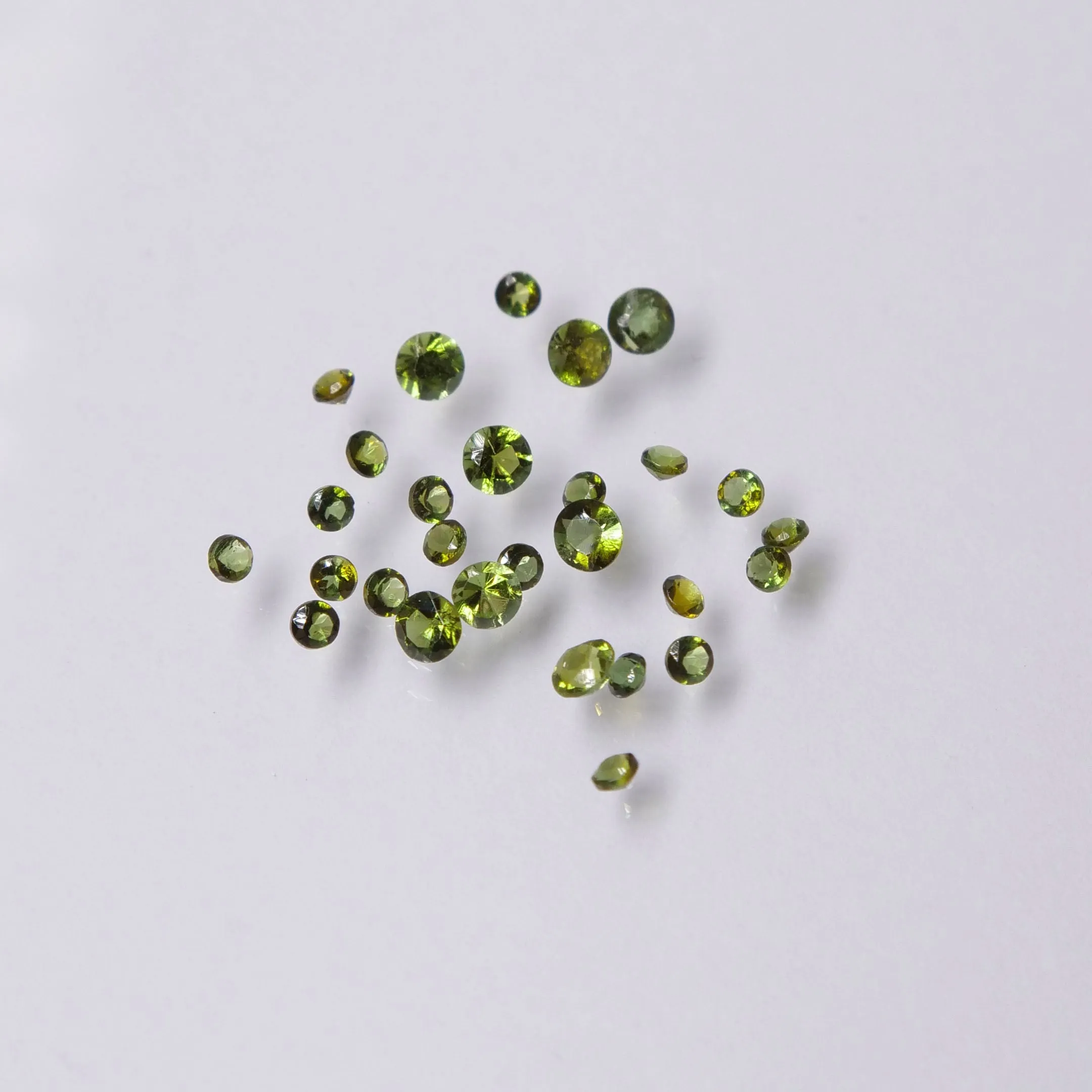 Tourmaline | green colour, round cut, accent stones